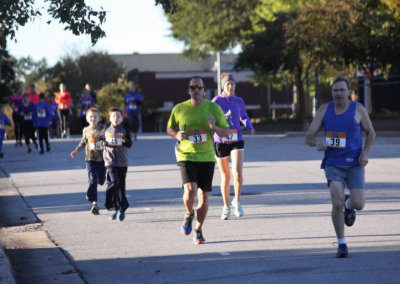 guy in green shirt running